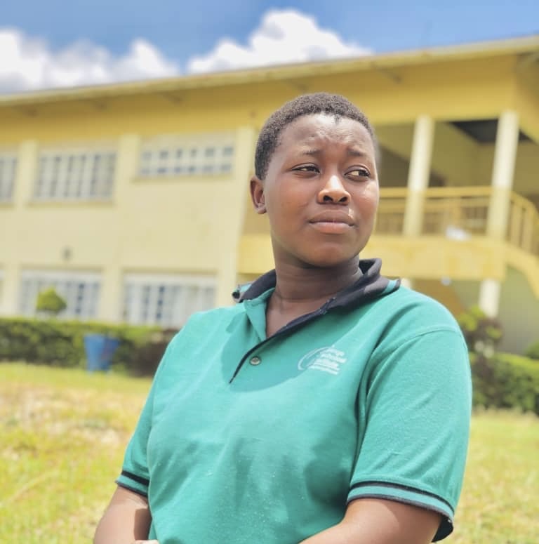 Shine Tusingwire in a green polo shirt in Uganda